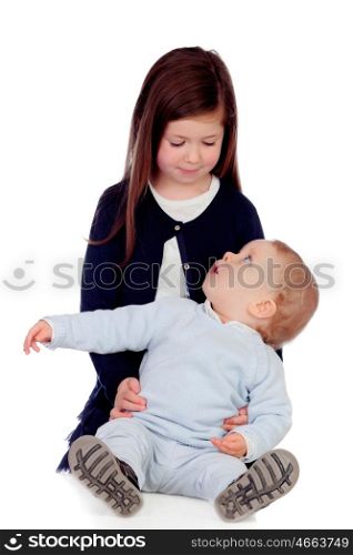 Loving girl taking care of her little brother isolated on a white background