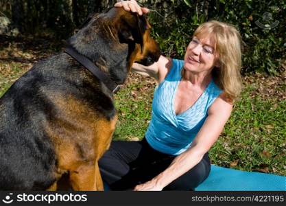 Loving pet owner talking to her dog as though he was a person.