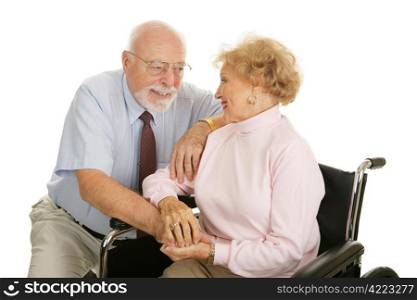 Loving senior couple coping with the wife&rsquo;s disability. Isolated on white.