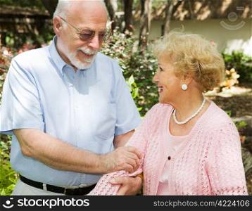 Loving senior couple enjoying a stroll outdoors.