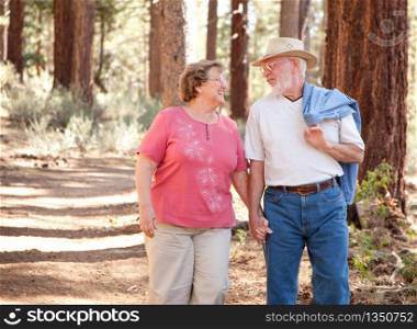 Loving Senior Couple Walking and Enjoying the Outdoors Together.