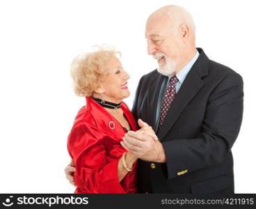 Loving seniors couple out dancing together. Isolated on white background
