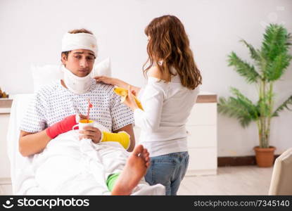 Loving wife looking after injured husband 