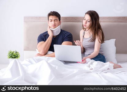 Loving wife taking care of injured husband in bed