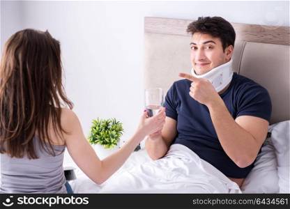 Loving wife taking care of injured husband in bed