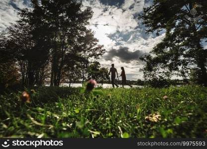 Loving young couple is having fun outdoors. Love and tenderness, dating, romance, family concept.. Loving young couple is having fun outdoors. Love and tenderness, dating, romance, family concept