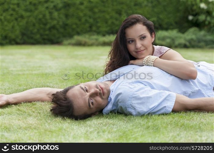 Loving young couple relaxing in park