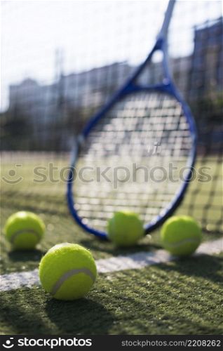 low angle tennis balls racket field