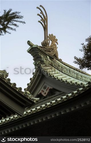 low angle traditional japanese wooden temple roof details
