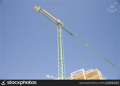 low angle view construction site against blue sky