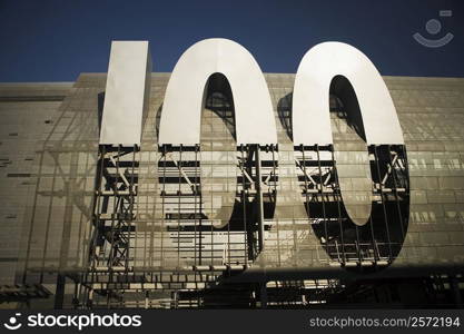 Low angle view of a &acute;100&acute; sign under construction