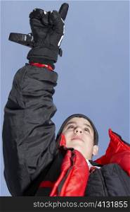 Low angle view of a boy pointing