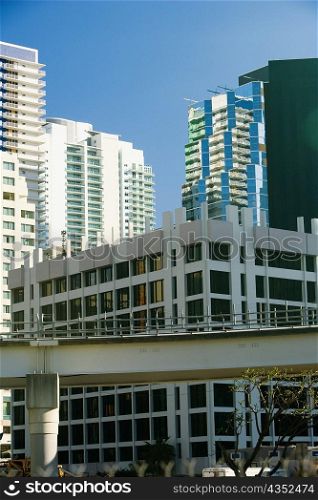 Low angle view of a bridge in front of buildings, Miami, Florida, USA