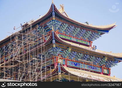 Low angle view of a building under repair, HohHot, Inner Mongolia, China