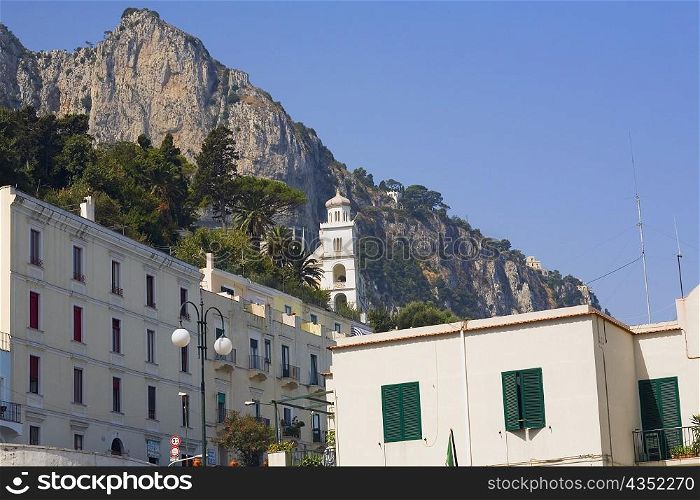 Low angle view of a building with a cliff in the background, Capri, Campania, Italy