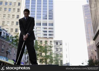 Low angle view of a businessman playing golf
