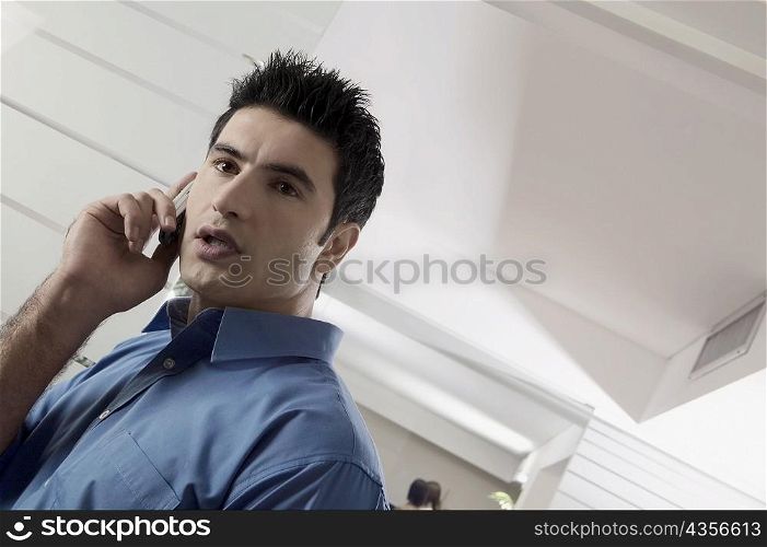 Low angle view of a businessman using a mobile phone