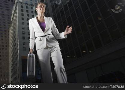Low angle view of a businesswoman carrying a briefcase