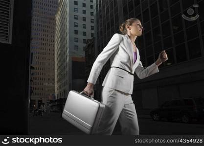 Low angle view of a businesswoman carrying a briefcase