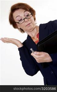 Low angle view of a businesswoman gesturing