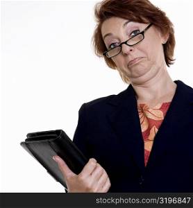 Low angle view of a businesswoman holding a file