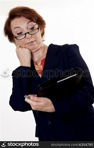 Low angle view of a businesswoman holding a pen