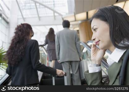 Low angle view of a businesswoman talking on a mobile phone
