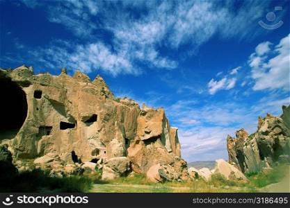 Low angle view of a cave dwelling, Zelve Valley, Cappadocia, Turkey