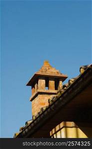 Low angle view of a chimney on a roof, San Gimignano, Siena Province, Tuscany, Italy