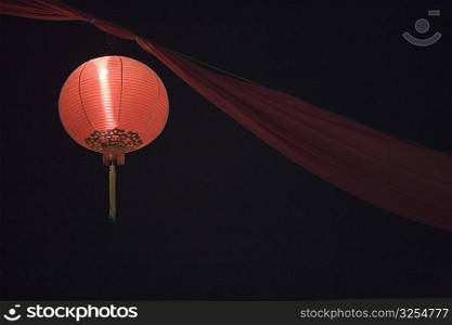 Low angle view of a Chinese lantern lit up at night