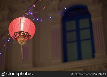 Low angle view of a Chinese lantern lit up at night, Chinatown, Singapore