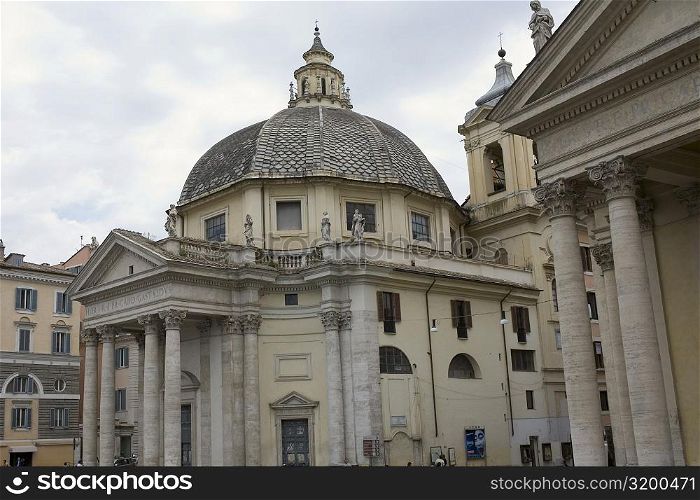 Low angle view of a church, Santa Maria Dei Miracoli, Santa Maria Di Montesanto, Piazza del Popolo, Rome, Italy
