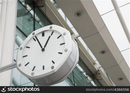 Low angle view of a clock outside an airport