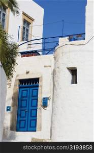 Low angle view of a closed door of a building, Patmos, Dodecanese Islands, Greece