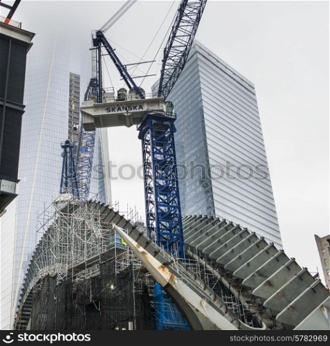 Low angle view of a crane by modern skyscrapers, Manhattan, New York City, New York State, USA