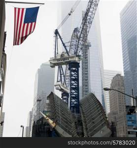 Low angle view of a crane by modern skyscrapers, Manhattan, New York City, New York State, USA