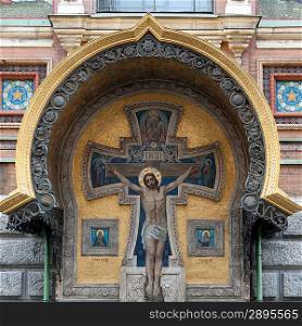 Low angle view of a crucifix on the wall of Church of the Saviour on Spilled Blood, St. Petersburg, Russia