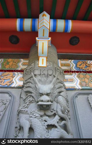 Low angle view of a dragon carved on the column in a monastery, Po Lin Monastery, Ngong Ping, Lantau, Hong Kong, China