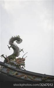 Low angle view of a dragon sculpture in a temple