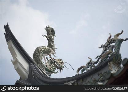 Low angle view of a dragon sculpture in a temple
