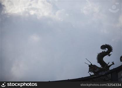 Low angle view of a dragon sculpture on a temple