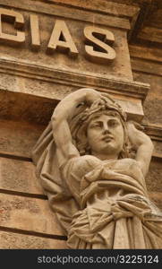 Low angle view of a female statue on a building, Havana, Cuba