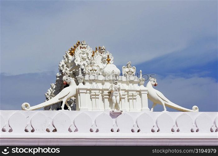 Low angle view of a figurine on top of a temple, Pushkar, Rajasthan, India