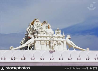 Low angle view of a figurine on top of a temple, Pushkar, Rajasthan, India