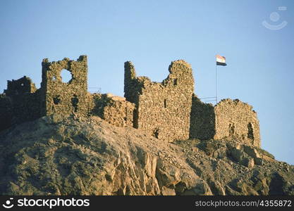 Low angle view of a flag at a ruined castle, Crusader Fort, Israel