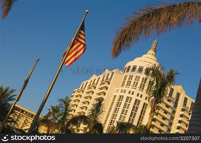 Low angle view of a flag in front of a building, Miami, Florida, USA
