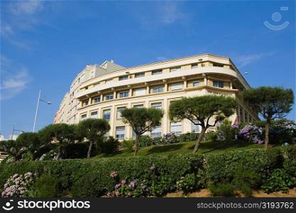Low angle view of a formal garden in front of a building, Biarritz, Pyrenees-Atlantiques, Aquitaine, France