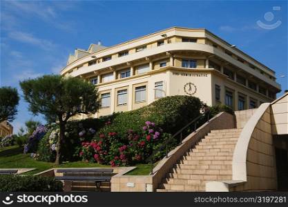 Low angle view of a formal garden in front of a building, Biarritz, Pyrenees-Atlantiques, Aquitaine, France