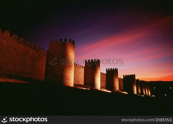 Low angle view of a fort at dusk, Avila, Spain