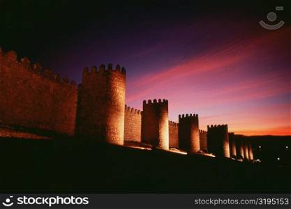Low angle view of a fort at dusk, Avila, Spain